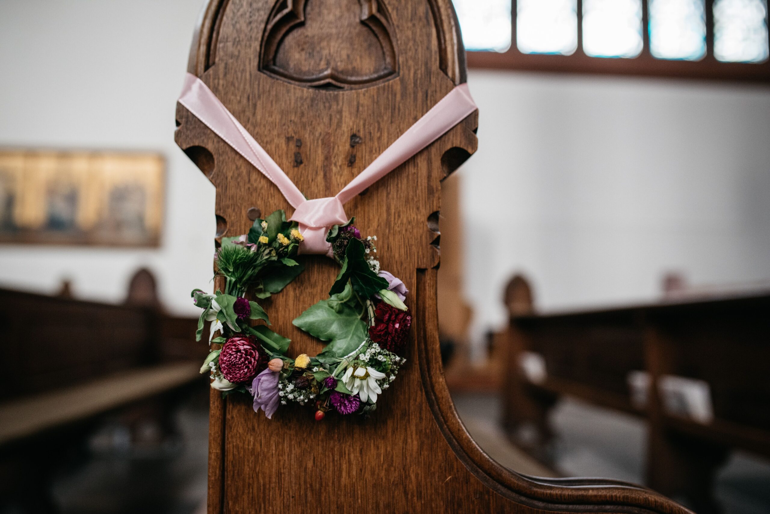 A beautiful flower crown placed inside a traditional church setting
